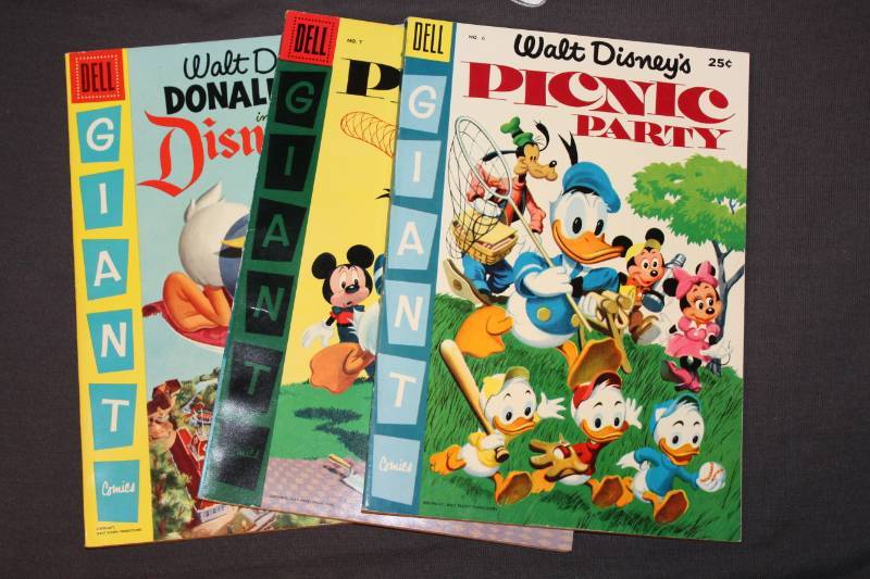lot 98 image: Dell Walt Disneys Donald Duck Picnic Party Comic Books #6,7, Dell Walt Disneys Donald Duck in Disneyland, Dell Mickey Mouse Comic Books #116,141,170