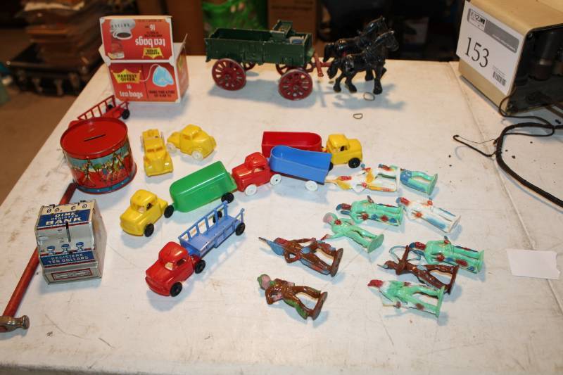 lot 152 image: Toy Trucks, Cowboy and Indian Figurines, Horse Drawn Carriage Table Art, Coin Banks, And More