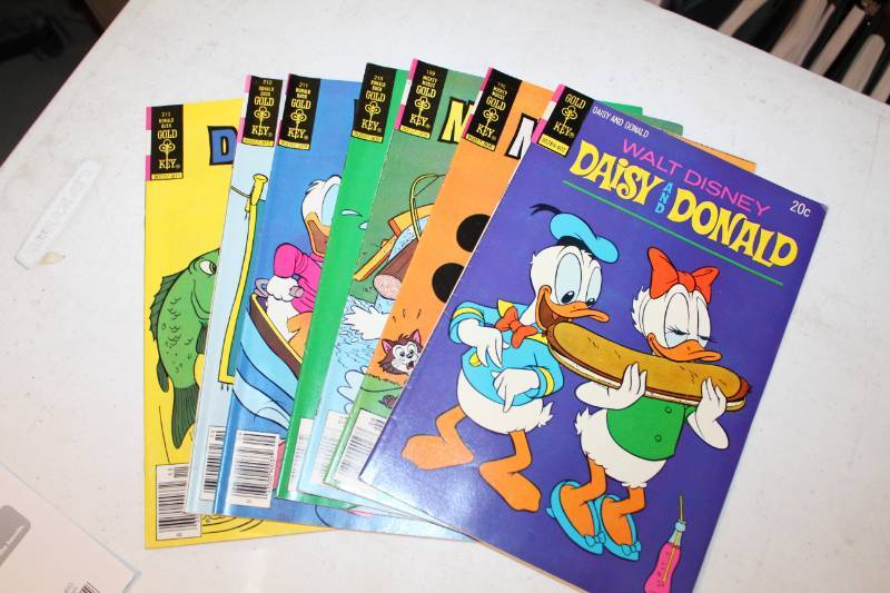 lot 122 image: Gold Key Walt Disneys Daisy Duck, Donald Duck, Mickey Mouse Comic Books
