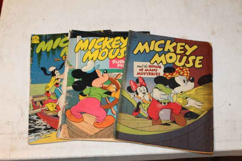 lot 103 image: Dell Mickey Mouse Comic Books - House of Mysteries #116, Submarine Piirates #141, Spookey Island #170