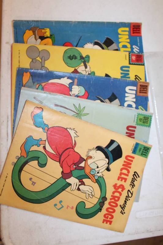 lot 105 image: Dell,Gold Key Walt Disneys Uncle Scrooge Comic Books - Jun-Aug,November,May,August, November #811, March-May