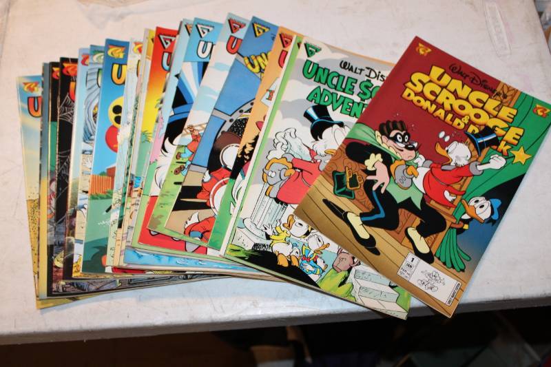 lot 108 image: Gladstone Walt Disneys Uncle Scrooge Comic Books - Aug #6, Sept #7, Dec #10,June #13,Aug #14,Sept #15,Oct #16,Nov #17,Dec #18,Jen #19, Mar #20, May #21, Sep #22,Nov #23,