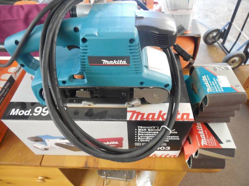 NEW - MAKITA BELT SANDER WITH ASSORTED BELTS