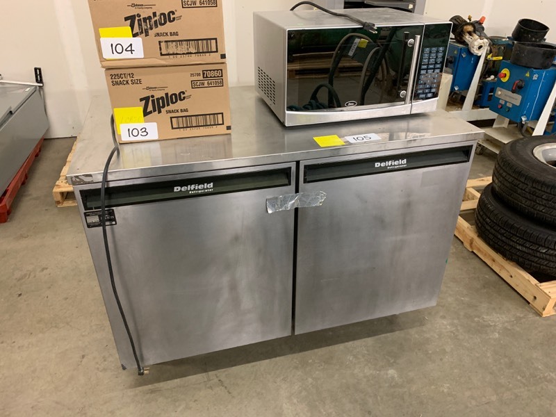 lot 105 image: Delfield refrigerator and household microwave