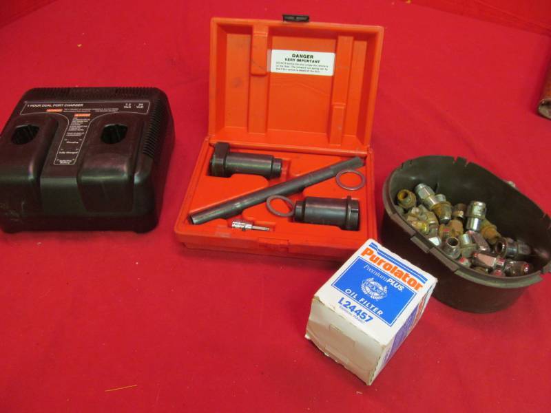 lot 215 image: Craftsman dual charger,LG front suspension tool set , lug nuts