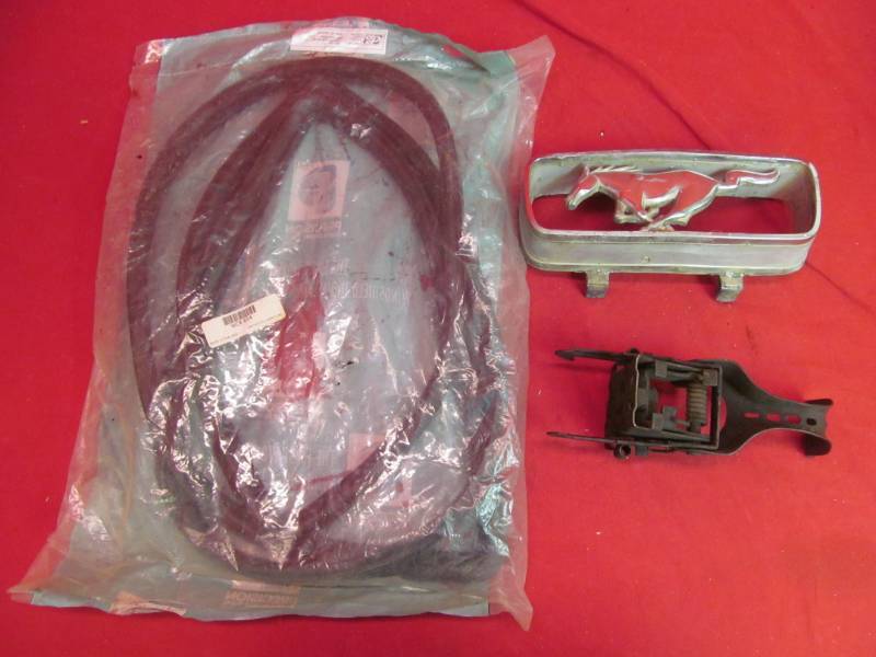 lot 242 image: weather strip, pony emblem, hood latch 64-68 mustang