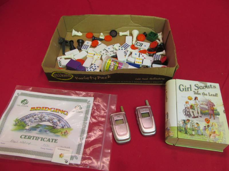 lot 26 image: Girl scout tin, certificate and pin, game pieces