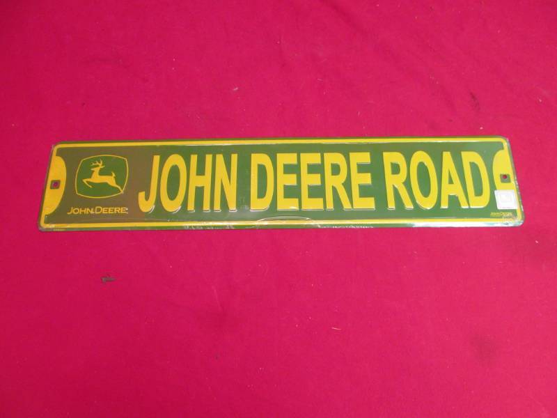 lot 92 image: John Deere sign