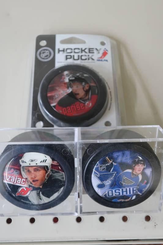 lot 534 image: Lot of Sioux Alum NHL Player Pucks