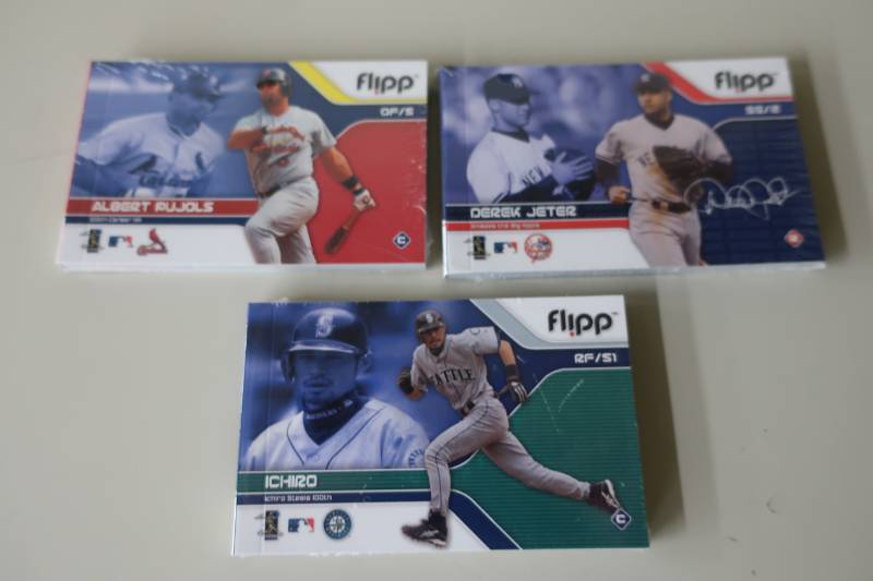 lot 551 image: 3 Unopened Flipp Books - Jeter, Ichiro, Pujols