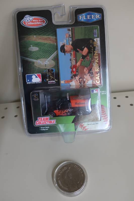 lot 571 image: Cal Ripken Collector Vehicle & Nolan Ryan Liberia Coin