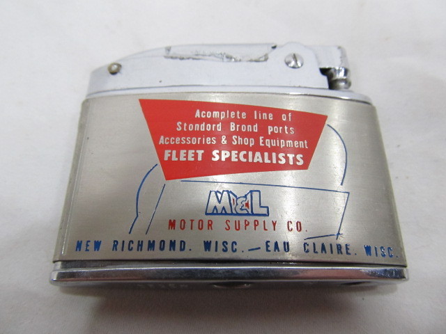lot 107 image: Vintage MOTOR SUPPLY CO Advertising Lighter