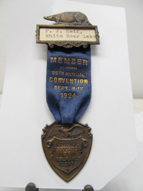 lot 152 image: Wonderful Figural 1924 Insurance Agents Convention Pinback Ribbon