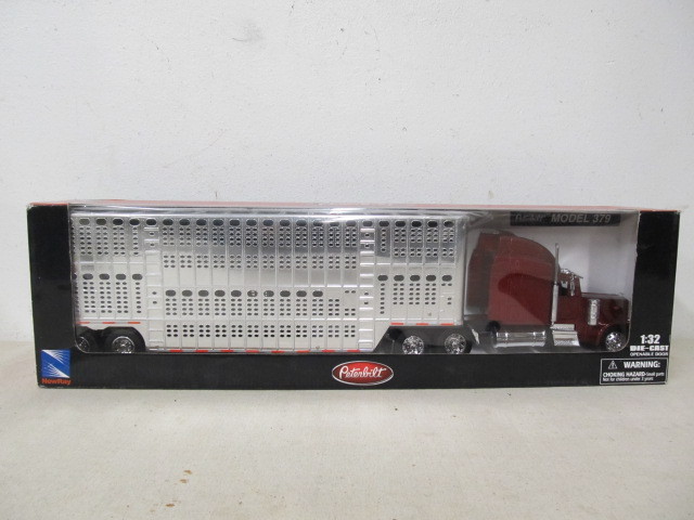 lot 212 image: Large 21 PETERBILT Diecast Semi Truck - NEW IN BOX