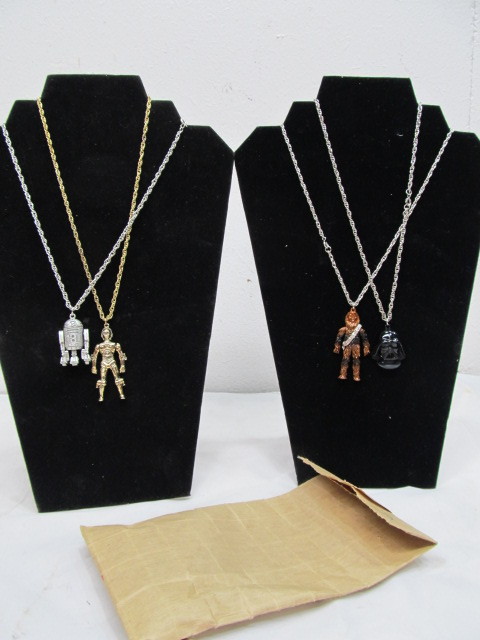 lot 4 image: Group of Original 1977 Star Wars Mail-Away Necklaces