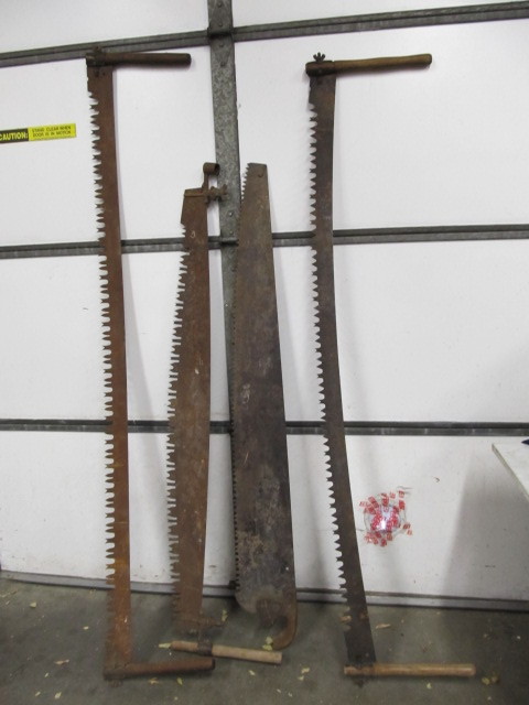 lot 5 image: Group of 4 LARGE Antique Lumberjack Saws