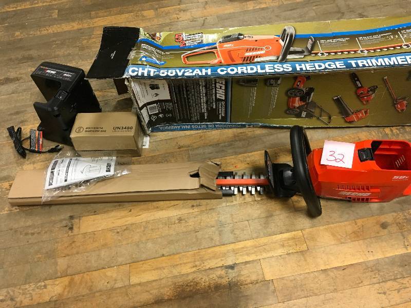 lot 32 image: ECHO 24 in. 58-Volt Lithium-Ion Brushless Cordless Hedge Trimmer - 2.0 Ah Battery and Charger Included in good working condition