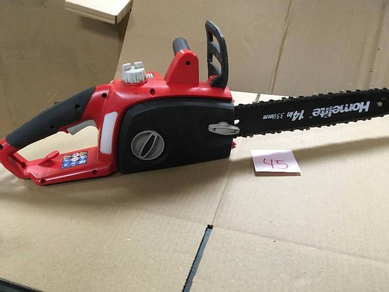 lot 45 image: Homelite 14 in. 9 Amp Electric Chainsaw  in good working condition