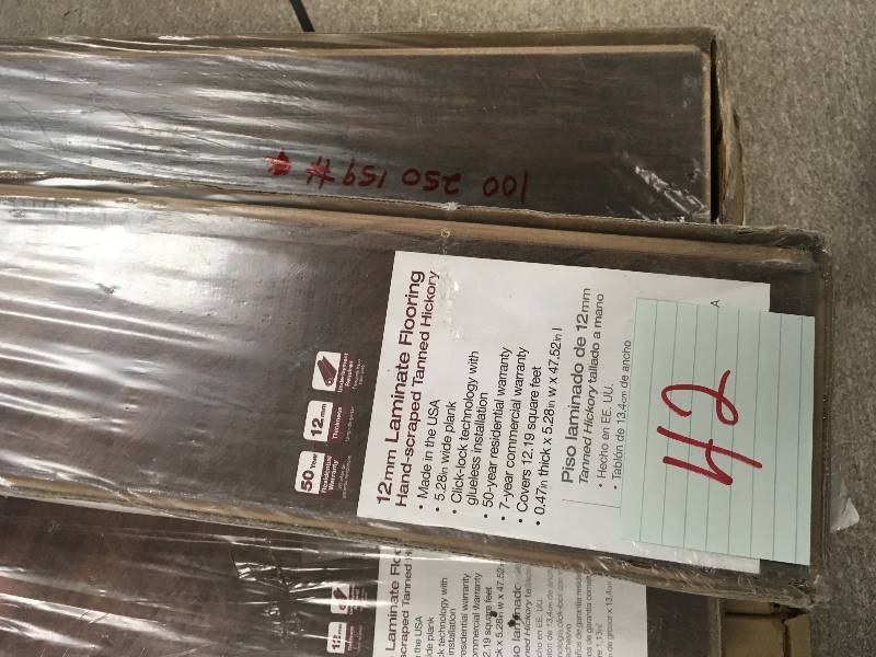 lot 42 image: LOT OF 10 CASES Home Decorators Collection Hand-Scraped Tanned Hickory 12 mm Thick x 5-932 in. Wide x 47-1732 in. Length Laminate Flooring (12.19 sq. ft.  case)