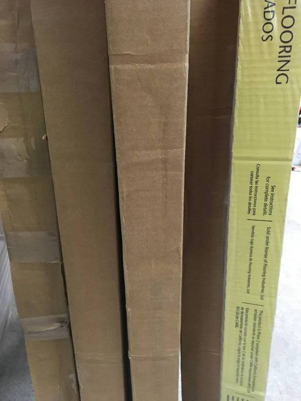 lot 65 image: LOT OF 4 CASES TrafficMASTER Dark Brown Hickory 7 mm Thick x 8-132 in. Wide x 47-58 in. Length Laminate Flooring (23.91 sq. ft.  case) not used