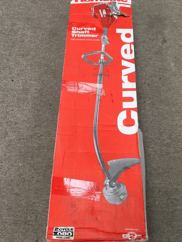 lot 89 image: Homelite 2-Cycle 26 cc Curved Shaft Gas Trimmer used in working condition