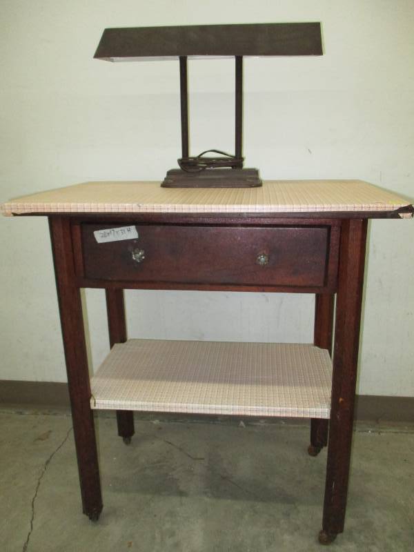 Old Desk with Small wheels and drawer, comes with lamp (bulbs are burnt out not able to tet)