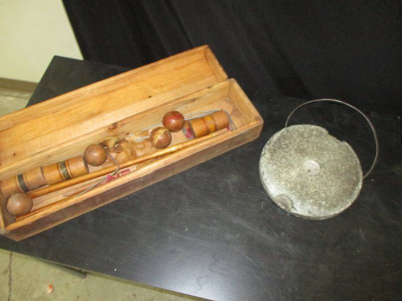 Old croquet set pieces and warming stone