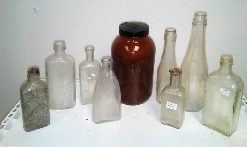 lot 13 image: 9 antique and vintage glass bottles. Some rare shapes.