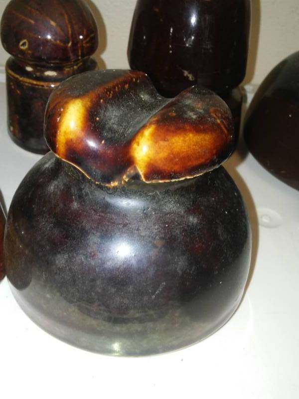 lot 26 image: 12 Brown ceramic insulators - variety.