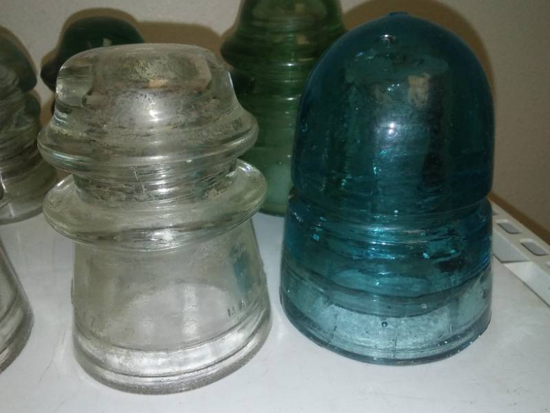 lot 29 image: 12 clear and green glass insulators - Variety.