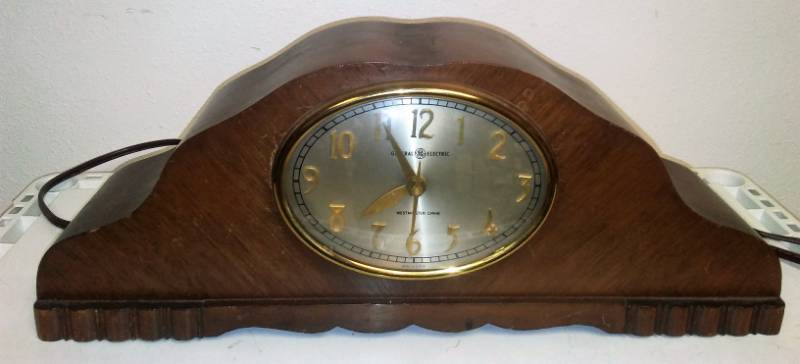 lot 31 image: GE Westminster Chime clock. Chimes on the quarter hour and hour