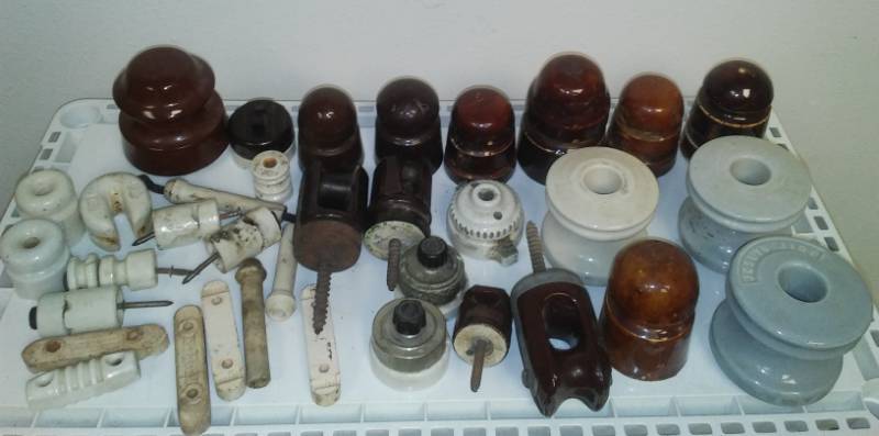 lot 36 image: Plethora of ceramic insulators.