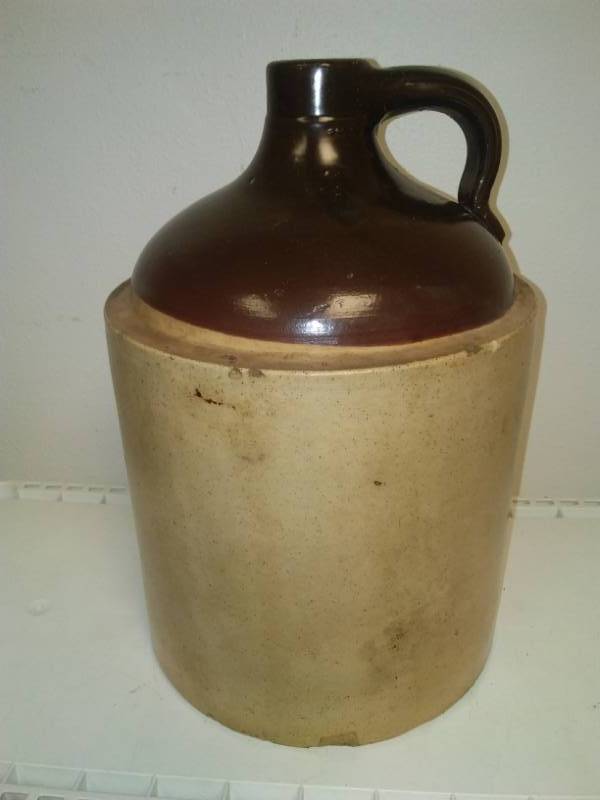 lot 40 image: 2 gallon crock jug, small chip see pictures for details.