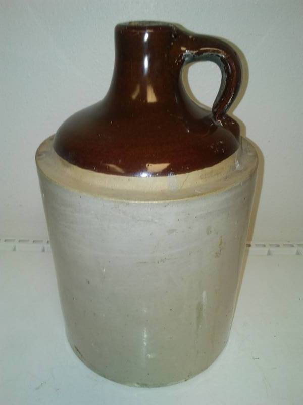 lot 57 image: 1 gallon crock jug with cork.