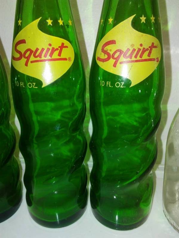 lot 60 image: 3 spirals squirt and two milk bottles - excellent.
