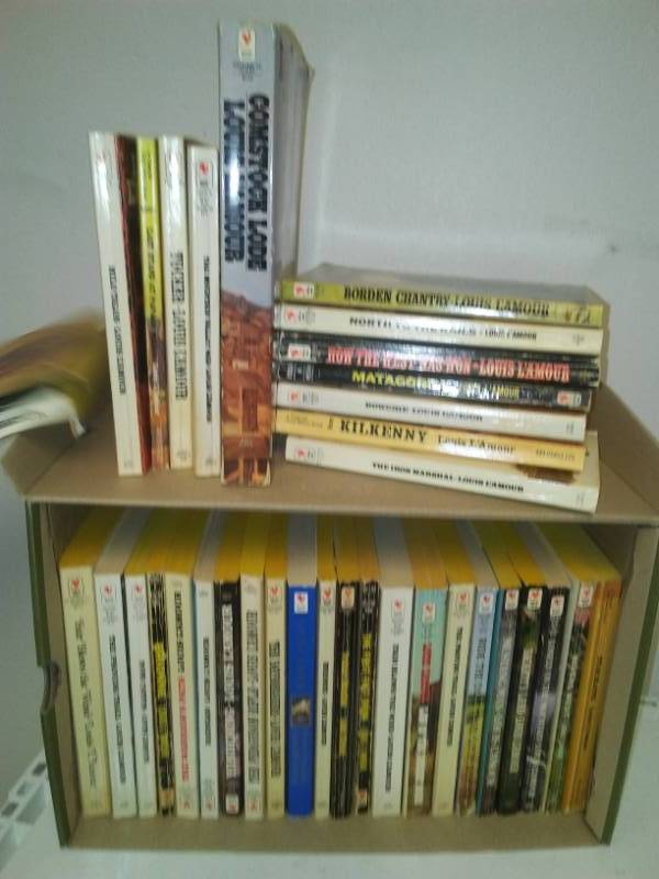 lot 70 image: Several Louie Lamour paperbacks.