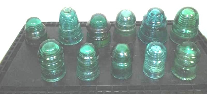 lot 86 image: 11 Green insulators.