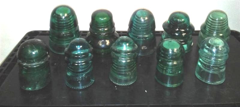 lot 87 image: 10 green insulators.