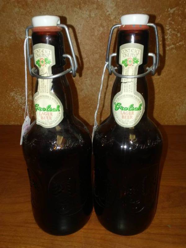 lot 113 image: Two Grolsch Lager beer bottles with porcelain cap and bail wire. Great