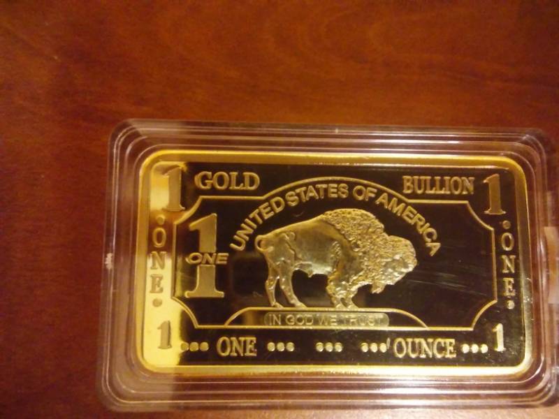 lot 130 image: NDSU Bison Troy Ounce Gold Plated 100 Mills, .999 Fine Gold