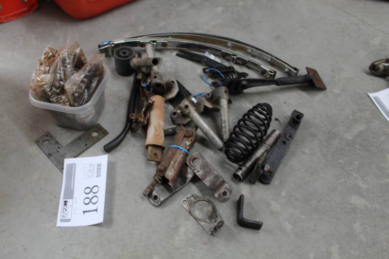 lot 188 image: Cushman Misc. Parts - Springs, Brackets, Trim, And More