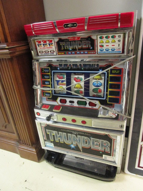 TOKEN OPERATED GAMING MACHINE