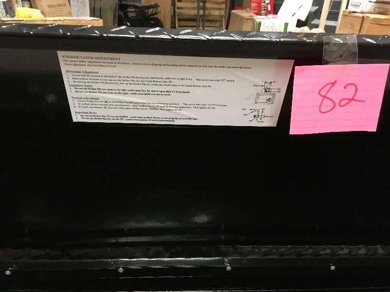 lot 82 image: Lund 60 in. Flush Mount Truck Tool Box some scratches and small dents present lock needs repair