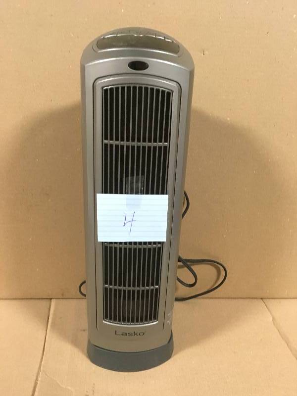 lot 4 image: Lasko 23 in. 1500-Watt Ceramic Tower Heater with Digital Display and Remote Control not used