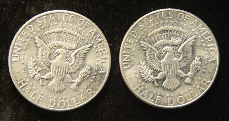 lot 16 image: 2 AU 1964 KENNEDY SILVER HALF DOLLARS