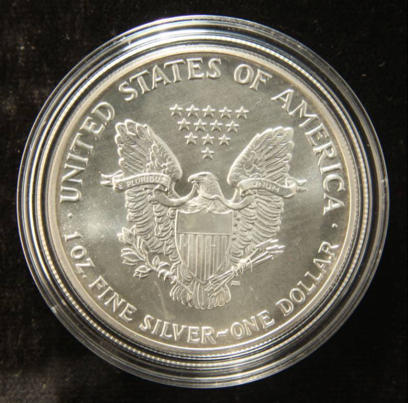 lot 34 image: 1987 AMERICAN SILVER EAGLE 1 TROY OZ. .999 FINE SILVER IN AIRTITE
