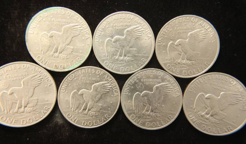 lot 37 image: 7 US EISENHOWER CLAD DOLLARS AS PICTURED