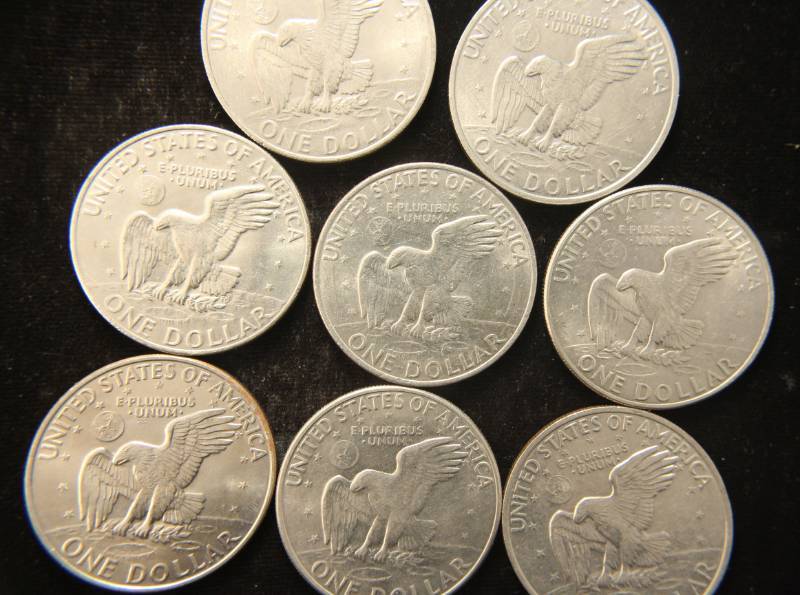 lot 54 image: 8 US EISENHOWER CLAD DOLLARS AS PICTURED