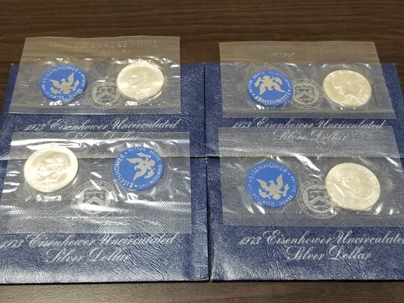 GROUP OF 4 US 1973-S EISENHOWER 40% SILVER DOLLAR MINT SEALED BLUE PACKS