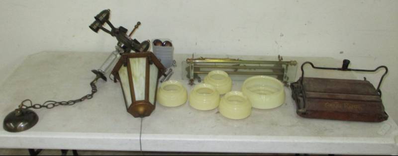 lot 34 image: Various Antique Pieces, wood Pulley, steel pulleys, lamp is not complete